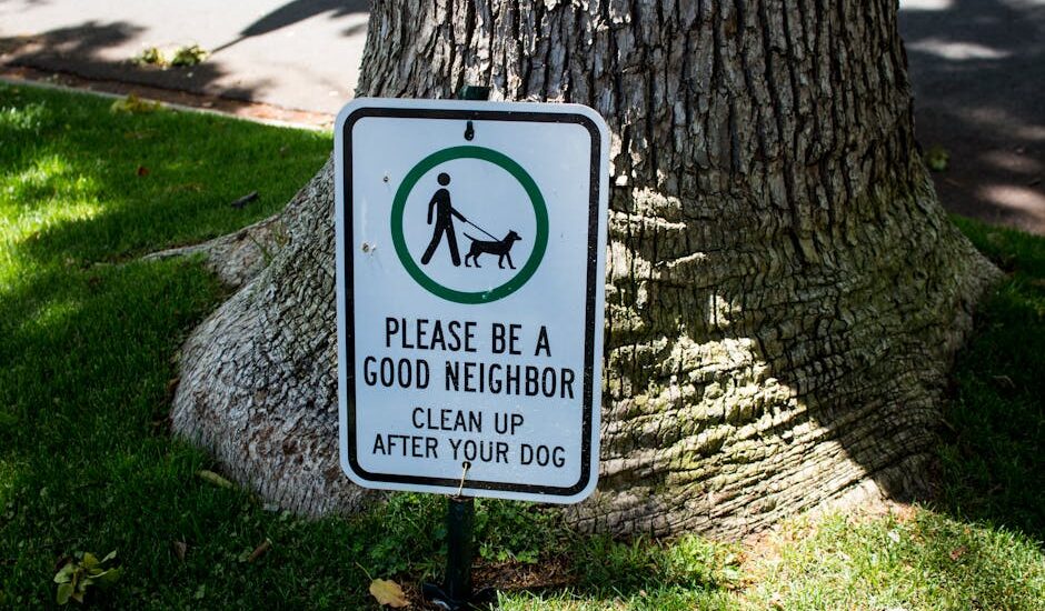 Sign in Beverly Hills park urging dog owners to clean up after their pets.