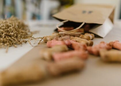 A variety of dog training treats spilling from a paper bag, related to training treat bags.